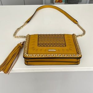 Detailed bag with gold chain strap/ zipper pocket and cell phone pockets inside.